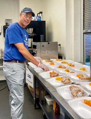 Washington Trust’s Chairman & CEO Edward O. 'Ned' Handy III participated in the company’s 222 Acts of Kindness challenge by spending the morning helping Amos House staff and volunteers prepare hundreds of to-go breakfast meals for guests.