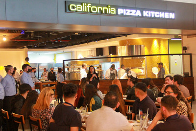 New CEO of CPK at Santiago International Airport welcomes customers for opening.
