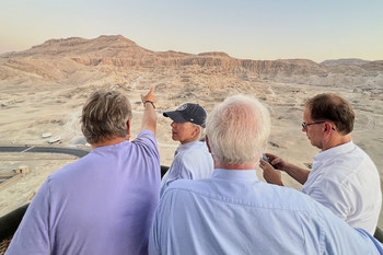 George Herbert, the 8th Earl of Carnarvon, pointing out the Mortuary Temple of Hatshepsut, to Karine, Tor and Rod during a sunrise hot air balloon excursion in Egypt’s Valley of the Kings. For more information, visit www.viking.com.