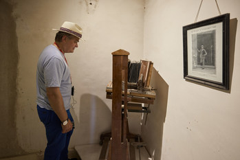 George Herbert, the 8th Earl of Carnarvon, looking at a camera and photograph of his great-grandfather, the 5th Earl of Carnarvon, inside Howard Carter’s house. A photographer and explorer, the 5th Earl was also Carter’s benefactor. Together, they discovered the tomb of Tutankhamun nearly 100 years ago, in November 1922. For more information, visit www.viking.com.