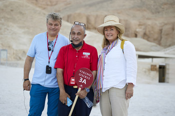 George Herbert, the 8th Earl of Carnarvon, and the Countess of Carnarvon, with a Viking expert Egyptologist, outside the tomb of Tutankhamun in the Valley of the Kings. For more information, visit www.viking.com.