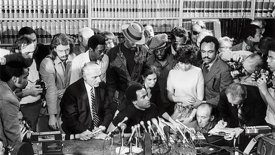 Huey Newton and his defense team Charles Garry & Fay Stender hold a press conference after the verdict (photo by Ilka Hartmann)