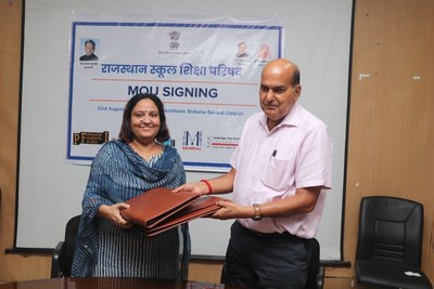 Dr. Mohan Lal Yadav of Samagra Shiksha Abhiyan and Dr Pallavi Singh of Educate Girls sign the MoU