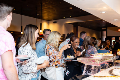 Guests enjoying a special display of sushi and sashimi