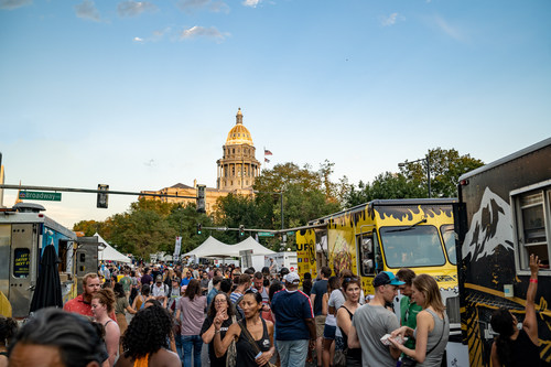 Taste of Colorado attendees browse the food truck offerings at the annual culinary tradition in 2019. (Photo by: Nikki A. Rae for VISIT DENVER)