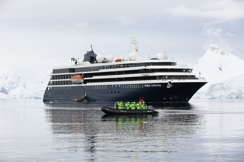 Guests of Atlas Ocean Voyages' World Navigator embark on a landing at Enterprise Island in Antarctica. Guests can make up to two landings daily aboard zodiacs to visit penguin rookeries, scientific outposts and abandoned whaling relics, as well as enjoy seaborn water safaris to study icebergs and catch sightings of seals, large seabirds, whales and other marine wildlife.