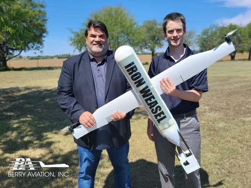 Berry Aviation Vice President of Unmanned Autonomous Systems, Rick Gaeta, (left) and Berry Aviation engineer, Brian Delano, display an example of the company’s Iron Weasel, an autonomous vehicle designed for use in the Group 1 UAS Air-Launched Effector market. The Berry Aviation UAS division is located in Stillwater, OK and is currently hiring additional engineering and operations staff to support its ongoing expansion efforts.