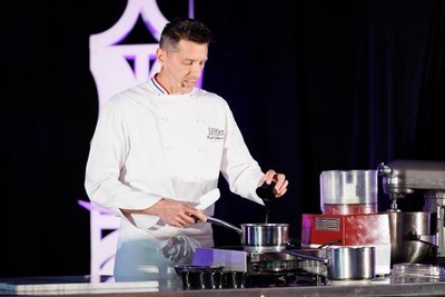 Frank Vollkommer, Certified Master Pastry Chef® (CMPC®), M.Ed, Director of Culinary Industry Development at Escoffier, seen here giving a keynote presentation on modern chocolate techniques.