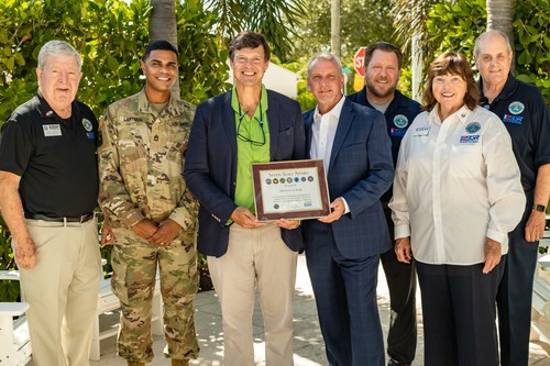 Mint Eco Car Wash receives Department of Defense's Seven Seals Award at flagship location from ESGR representatives. Pictured from left to right: Peter Caspari, Angel Lantigua, Geoff Jervis, Vic Monteleone, Buck McTee, Paula and Paul Nicoletti.