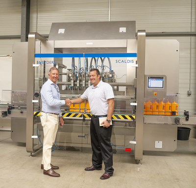 Yves Van Bavel (left), CEO of Sneyders shakes hands with Corey Seiver (right), CEO of Specialty Equipment sealing the deal of their new exclusive U.S. distribution agreement