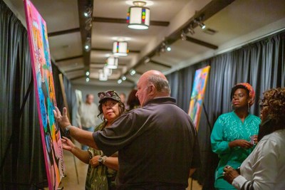 Patrons experiencing an art display at Harris County Cultural Arts Center