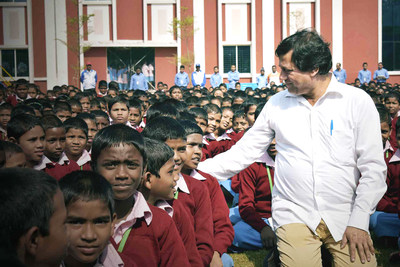 Dr Achyuta Samanta, founder of KIIT and KISS sharing a light moment with students of KISS Dr Achyuta Samanta, founder of KIIT and KISS sharing a light moment with students of KISS