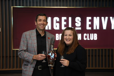 University of Louisville Vice President/Director of Athletics Josh Heird and Angel's Envy General Manager Gigi DaDan toast the recently renovated Angel's Envy Bourbon Club. (Photo Credit: Adam Creech, Louisville Athletics)