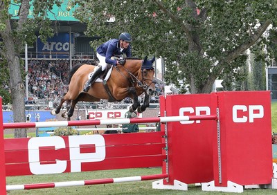 Daniel Deusser and Killer Queen VDM jumped three clear rounds to win the $3 million CP International Grand Prix. (c) Spruce Meadows Media/Jack Cusano (CNW Group/Canadian Pacific)