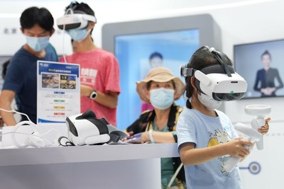 A girl tries a VR device at the cultural and tourism services exhibition hall in the Shougang Park during the 2022 CIFTIS in Beijing, capital of China, Sept. 4, 2022. (Xinhua/Ju Huanzong) (PRNewsfoto/Xinhua Silk Road)