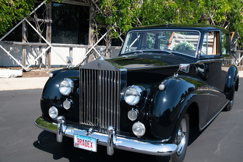 The Bradford Exchange, a global leader in marketing and eCommerce, honored the legacy of Queen Elizabeth II in a special way. The company owns a 1957 Rolls Royce that was commissioned for the Queen Mother to use during her 1957 Royal Tour of Rhodesia. Later it was used by the Royal Family and Queen Elizabeth II in the United Kingdom. The company brought the historic vehicle out of storage and christened it with a wreath of white lilies and Lilies of the Valley - Elizabeth's favorite flower.