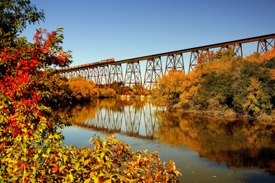 The High Line Bridge, adorned with fall color, crosses the Sheyenne River at Valley City, North Dakota. Credit: Katherine Plessner/North Dakota Tourism