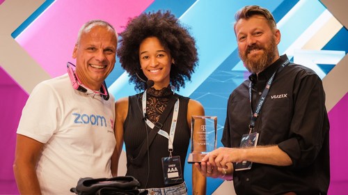 Thomas Novotny, CTO of Innovation at Deutsche Telekom Business Solution, an event hostess, and Sebastian Anjou, Vuzix European Business Development Director Thomas Novotny, CTO of Innovation at Deutsche Telekom Business Solution, an event hostess, and Sebastian Anjou, Vuzix European Business Development Director