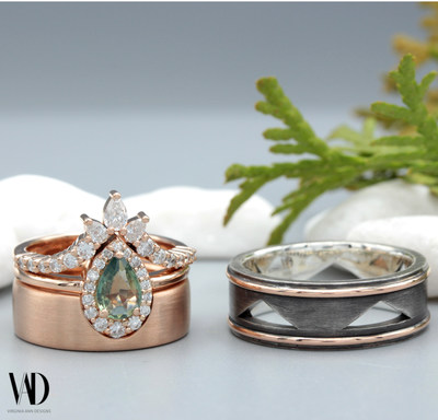 A custom wedding set featuring a teal sapphire engagement ring, matching rose gold wedding ring, and rose gold and sterling silver men's wedding band.