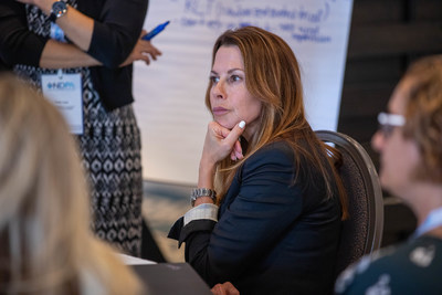 Attendee listening to discussion