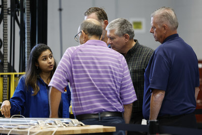 Visitors participate in a facility tour at the Novelis Customer Solution Center on Thursday, Sept. 15, 2022 in Novi, Mich. (Rick Osentoski/AP Images for Novelis)