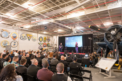 XL Construction’s Dave Beck, executive vice president (standing), and Eric Raff, executive chairman, present company history to 350+ employees at XL Construction’s Vision Launch event to celebrate its 30th Anniversary aboard the USS Hornet at the Sea, Air and Space Museum in Alameda, California.