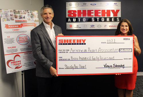 Vince Sheehy, President of Sheehy Auto Stores, presents the company's Sheehy Has Heart donation to Soula Antoniou, Executive Director for the American Heart Association, Greater Washington Region.
