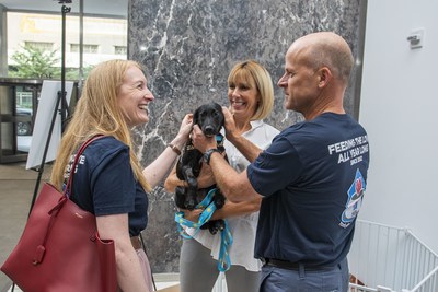 Nicki Baty, President and General Manager of Hill's Pet Nutrition US, and Noel Wallace, Chairman, President and CEO of Colgate-Palmolive, attend a Clear The Shelters adoption event in the lobby of the Colgate-Palmolive offices on Park Avenue in New York, N.Y.