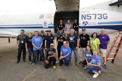 Volunteers from Hill's Pet Nutrition, Greater Good Charities and local shelters, Morristown Airport employees and First Lady of New Jersey Tammy Snyder Murphy gather for a life-saving pet airlift of more than 140 at-risk pets from overcrowded shelters in Louisiana and Alabama to shelters in the Northeast to help be adopted as part of NBCUniversal Local's Clear The Shelters campaign.