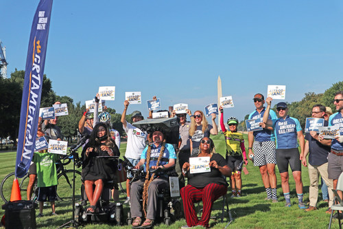 Supporters join Ian's Ride, Rails-to-Trails Conservancy and United Spinal Association on Sept. 21, 2022, on the National Mall in Washington, D.C., to cheer on Ian Mackay as he departs for a 475-mile journey in his power wheelchair on the Great American Rail-Trail. Photo by Anthony Le, courtesy of Rails-to-Trails Conservancy.