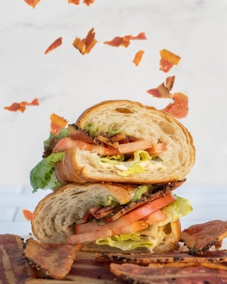 Veggie Grill signature vegan BLT Avocado Croissant featuring OZO Foods Plant-Based Cracked Black Pepper Bacon