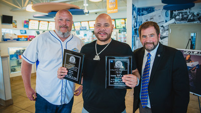 Hip-hop artist Fat Joe (middle) was inducted into White Castle's Cravers Hall of Fame as a Craver in Extremis. White Castle VP of operations Chris Shaffery (left) and White Castle VP Jamie Richardson (right) presented Fat Joe with plaques, one honoring his induction into the Cravers Hall of Fame and one paying tribute to a booth -- the “Fat Joe Lean Back Booth” -- named in his honor.