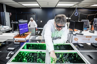 CEO and founder Dr. Bjorn Manuel Hegelich aligning laser beams within a laser system at TAU's facility in Austin, Texas.