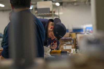 Fabrication specialists and aircraft designers collaborate on aircraft mechanics at RapidFlight, a Manassas, Virginia based unmanned aircraft systems provider. Image courtesy of RapidFlight, LLC.