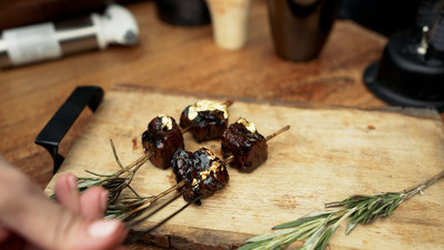 Certified Angus Beef ® Prime gold-leafed tender and tangy spinalis served on a rosemary skewer