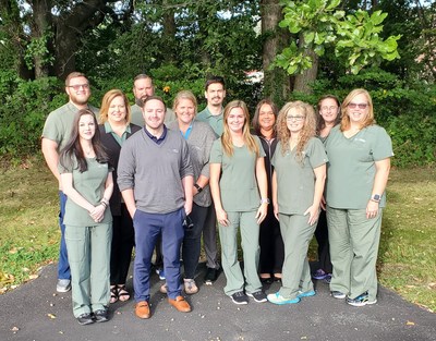 Recently integrated Newburgh, IN staff pose in their new St. Croix Hospice scrubs.