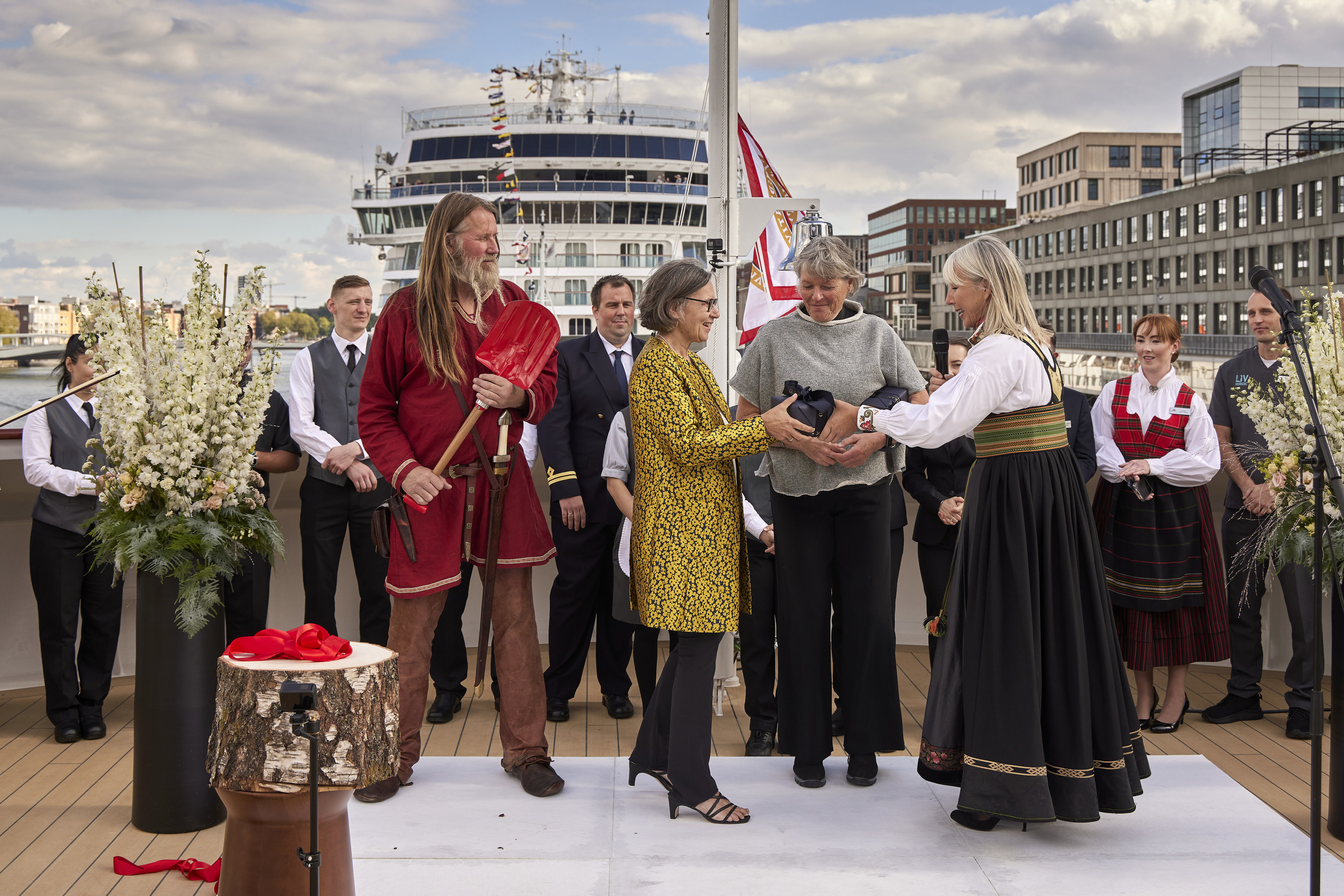 Viking Executive Vice President Karine Hagen (right) presents gifts to Liv Arnesen (center) and Ann Bancroft (right), renowned explorers and godmothers of the Viking Octantis and the Viking Polaris, respectively  (Image at LateCruiseNews.com - October 2022)