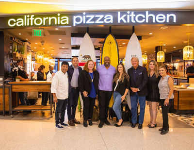 CPK team congratulating Greg Plummer on the new LAX Terminal 6 California Pizza Kitchen.