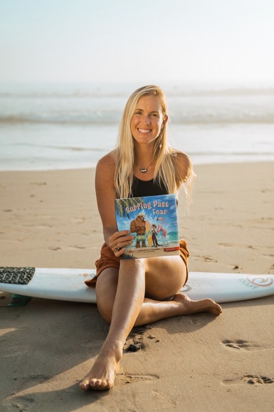 Bethany Hamilton with her children's book, Surfing Past Fear