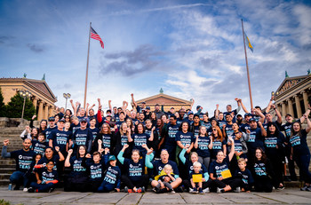 Employees of the Building Strength Together team for Citadel Credit Union on the steps of the Philadelphia Art Museum.