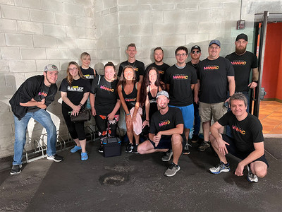 PostcardMania's 19-person Hurricane Ian Relief Task Force poses for a quick photo in Clearwater, FL before heading south with truckloads of supplies for those affected by the storm. Another group is set to head down again today to distribute more supplies and help with clean up.