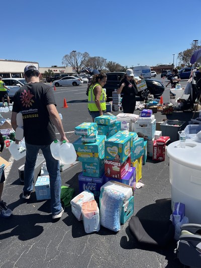 Members of PostcardMania's Hurricane Ian Relief Task Force get busy distributing much-needed supplies alongside the Cajun Navy Ground Force.