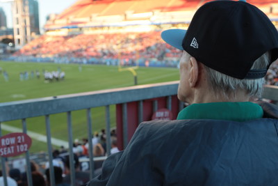 Joseph Coughlin, resident at Chartwell Avondale in Toronto, watches his all-time favourite football team, the Toronto Argonauts, play at BMO Field for the first time in several years thanks to The Chartwell Foundation. (CNW Group/The Chartwell Foundation)