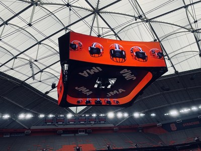 A sixty-foot square digitally printed scrim hangs across a suspended scoreboard inside the JMA Dome, prominently featuring the JMA logo