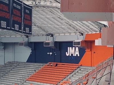 Lightweight aluminum channel letters spelling the dome's name are mounted above stadium seating.