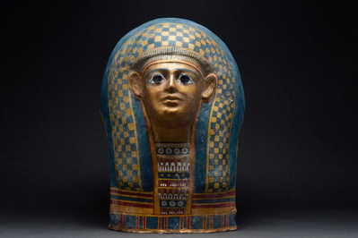 Egyptian mummy mask cartonnage, Ptolemaic Period, circa 332-30 BC. Made from layers of plaster-covered linen, polychrome painted and gilded. Size: 500mm x 340mm (20in x 13.4in). Provenance: most recently in the collection of an Oxfordshire (England) medical doctor. Accompanied by Art Loss Register Certificate. Estimate £20,000-£40,000 ($22,938-$45,876)