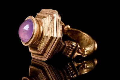 Greek Hellenistic gold hinged finger ring with stepped profile and inset cabochon amethyst, circa 3rd to 1st century BC. Weight: 22.21g (0.7142ozt). Provenance: property of London doctor; previously in Swiss family's private collection since the 1980s. Accompanied by professional historical report from Ancient Report Specialists. Estimate £20,000-£40,000 ($22,938-$45,876)