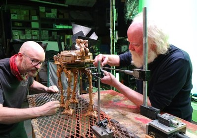 Phill Tippett, (right), Oscar® and Emmy® Award-Winning Visual Effects Supervisor and Producer and Founder of Tippett Studio Inc., shown here working on stop motion visual effects for The Mandalorian from Disney+ (CNW Group/AMPD Ventures Inc.)
