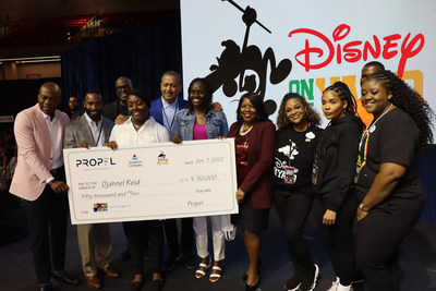 Djahnel Reid (front third-from-left) is presented with a scholarship from Southern Company, Disney, Propel Center and HBCU Foundation representatives during HBCU Week at Walt Disney World Resort on Friday, October 7, 2022. (Photo provided)