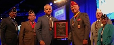 Berry Aviation COO, Sean Iverson (center left) accepts the Large Employer of Veterans Award from American Legion National Commander and his team at the national convention. Berry consistently hires and develops veterans for employment and growth.